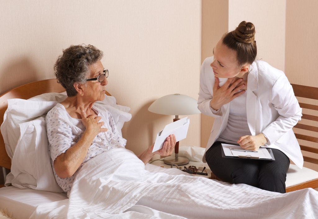 Old woman with senior social work assistant